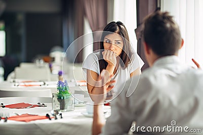 Worried woman doubting,having relationship problems.Making a decision.Wandering,bored,not listening conversation. Stock Photo