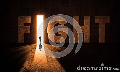 Worrier man Entering A Fight Door Light In dark big Concrete Hall. Worrier Person. Fight World Letters On Grungy wall Stock Photo