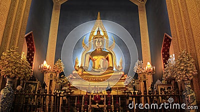 Worship. Golden Buddha With Flowers Vese Stock Photo