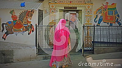 Worshipper entering a Hindu temple in Udaipur, India Editorial Stock Photo