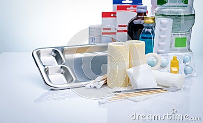 Wound care dressing set. Wound care equipment in hospital for nurse. Conform bandage, forceps, alcohol, cotton sticks, povidone- Stock Photo