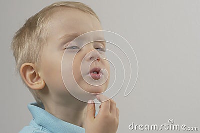 Wounded chin of the child, abrasions on the boy`s chin. close-up Stock Photo
