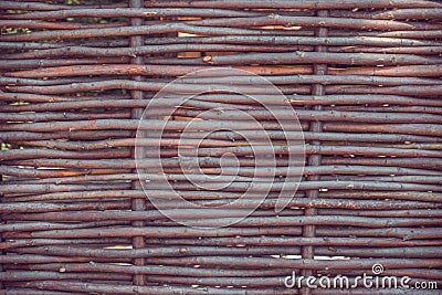 Woven willow fence. Rustic style Stock Photo