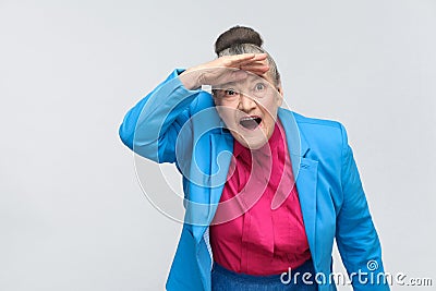 Wow! Aged woman with shocked face Stock Photo