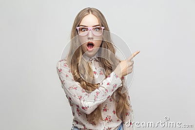 Wow! Amazing news! Beautiful young adult girl, showing finger Stock Photo
