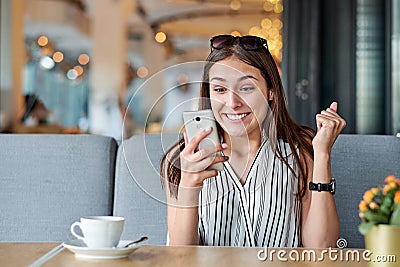 Wow effect, woman enjoying a good message on the phone. Emotions, surprise, delight Stock Photo