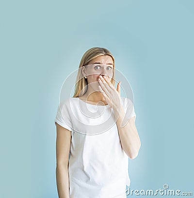 Wow emotion. Portrait young woman looking excited, hand on month, isolated wall. Shocked surprised stunned Stock Photo