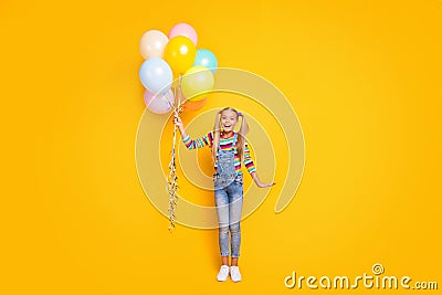 Wow it for me. full size photo amazed crazy funny kid hold many air baloons she get receive from her family on Stock Photo