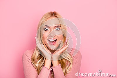 Wow, sale. Close up portrait of young pretty woman with long blond hair looking exited holding her mouth open, hands near cheeks, Stock Photo