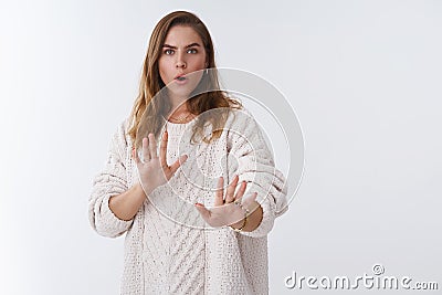 Wow slow down take easy relax I just joking. Portrait intense worried woman trying calm pissed angry client step back Stock Photo