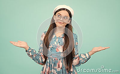 Wow, it& x27;s unbelievable. Shocked teenager child pointing aside at copy space. Teen girl pointing with two hands and Stock Photo