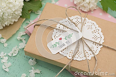 Wrapped gift and flowers Stock Photo