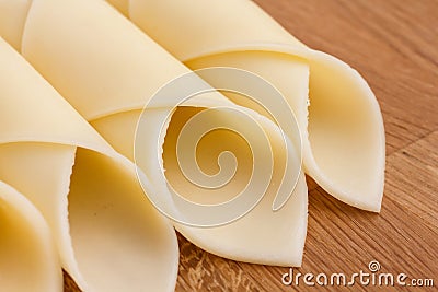 Wrapped yellow cheese slices Stock Photo