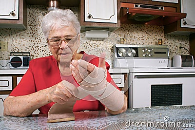 Wrapping arm with bandage Stock Photo