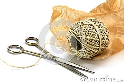 Wrapping material, ball of string, paper and scissors isolated w Stock Photo