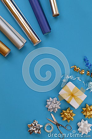 Gift wrapping utensils on cyan background Stock Photo