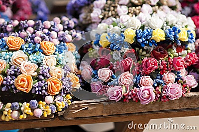 Wreath or diadem head wear made from handmade roses on fair Stock Photo