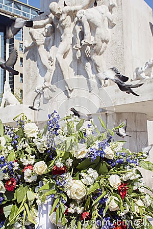 Wreath with white roses near the monument in Amsterdam Stock Photo