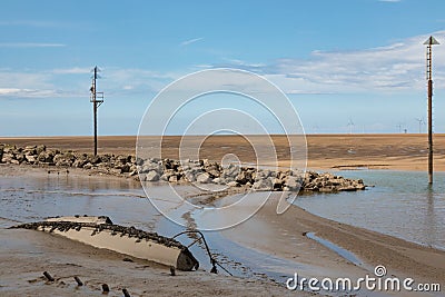 Wreck of a small boat in the mud Leasowe Wirral June 2019 Stock Photo