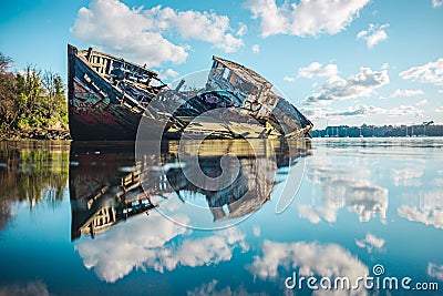 Wreck of a wooden fishing boat abandoned in the clouds Editorial Stock Photo