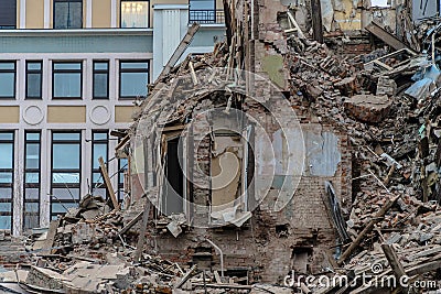 The wreckage and the skeleton of an old building destroyed to make room for modern development Stock Photo