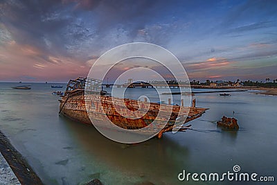 wrecked boat that sank on the beach Stock Photo