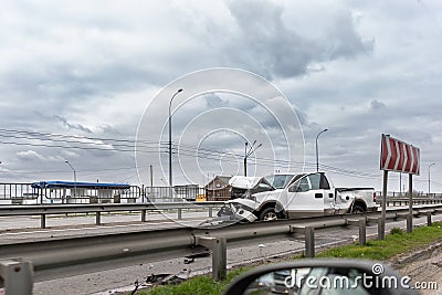 Wrecked car pickup truck crash accident on highway city road. Damaged big white vehicle after collision accident waiting Stock Photo