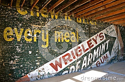 Wrigley chewing gum ad on an old wall of a building under renovation Editorial Stock Photo