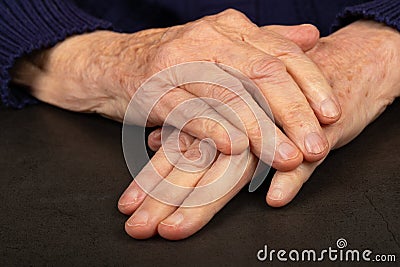 Wrinkled elderly hands Stock Photo