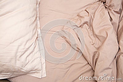 Wrinkled sheet pillows blanket bed home textile Stock Photo