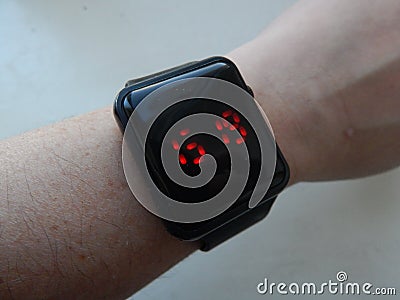 Wrist electronic smart watch is worn on the Stock Photo