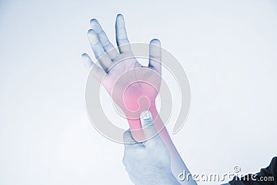 Wrist injury in humans .wrist pain,joint pains people medical, mono tone highlight at wrist Stock Photo