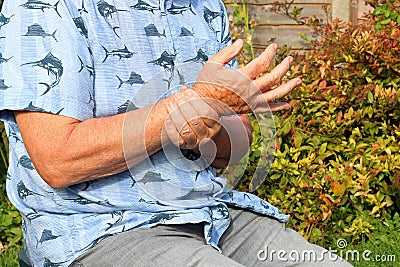 Wrist pain. Arthritis. Senior in pain. Stock Photo