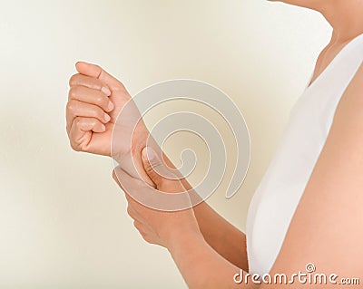Wrist pain older women Stock Photo