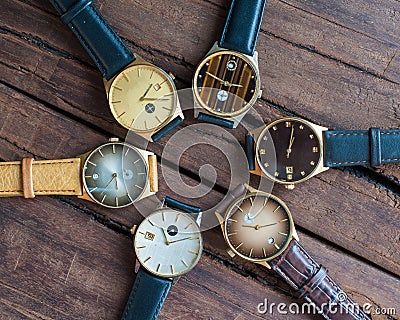 Wrist watches on a wooden table Stock Photo