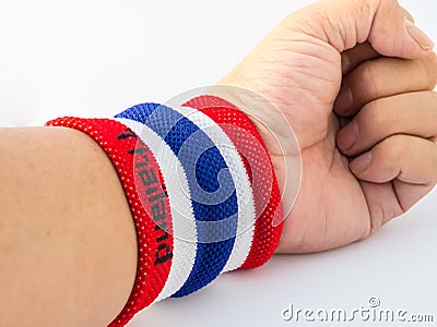 The wristband have colourful on wrist human for cheer Stock Photo