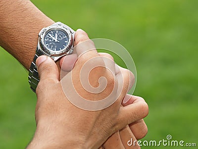 Wristwatch on wrist Stock Photo