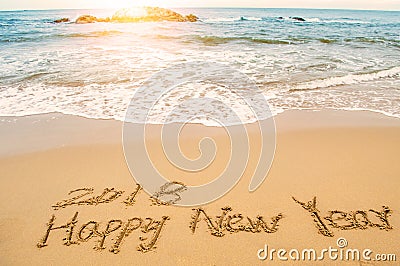 Write happy new year 2018 on beach Stock Photo