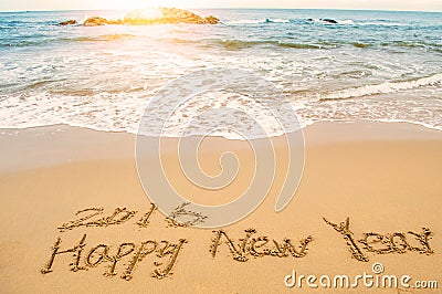 Write happy new year 2016 on beach Stock Photo