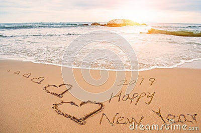 Write happy new year 2019 on beach Stock Photo