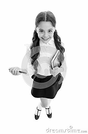 Write note to remember. Child school uniform smart kid happy make note. Child girl happy school uniform clothes holds Stock Photo