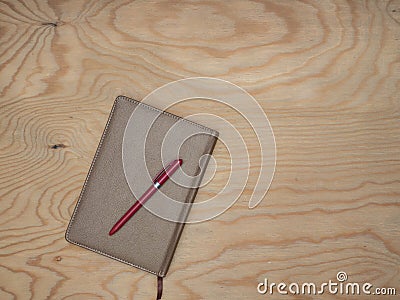 Notepad with wood table handle. Stock Photo