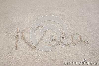 Write the word I Love Sea on the sand beach. Stock Photo