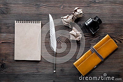 Writer acsessories. Vintage notebook, feather pen, crumpled paper on white background top view mockup Stock Photo