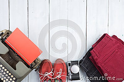 writer is going on a journey - typewriter, jeans, camera, shoes Stock Photo