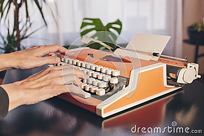 Writer`s hands on retro typewriter. Concept classic literature Stock Photo