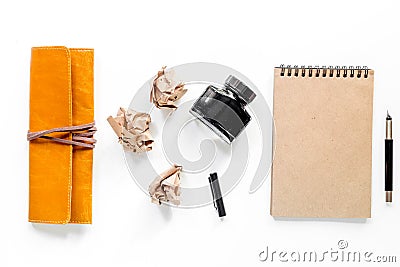 Writer workplace with vintage notebook and crumpled paper on white background top view mockup Stock Photo