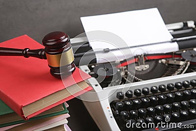 Writers desk - typewriter, books and judge's gavel, copyright protection law concept Stock Photo