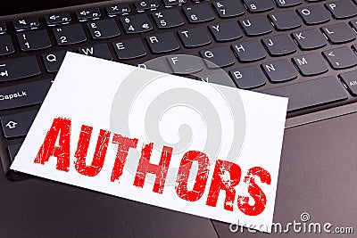 Writing Authors text made in the office close-up on laptop computer keyboard. Business concept for Word Message Text Typography Wo Stock Photo