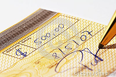 Writing a bank check Stock Photo